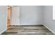 Neutrally painted bedroom with wood-look floors and natural light, interior door at 3175 Dogwood Dr, Atlanta, GA 30354