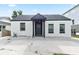 Charming home with a white exterior, black trim, and a covered entry at 3175 Dogwood Dr, Atlanta, GA 30354