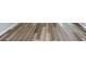 Close-up view of newly installed gray and brown wood-look flooring at 3175 Dogwood Dr, Atlanta, GA 30354