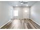Bright and airy living room featuring wood-look floors, ceiling fan, and neutral color palette at 3175 Dogwood Dr, Atlanta, GA 30354