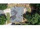 Birds eye view of the property highlighting a large roof, backyard deck, and driveway at 4046 Creekview Ridge Dr, Buford, GA 30518