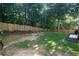 A backyard with a wooden fence provides privacy at 4046 Creekview Ridge Dr, Buford, GA 30518