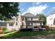 A spacious backyard featuring a deck, lush lawn, and mature trees, perfect for outdoor entertaining at 4046 Creekview Ridge Dr, Buford, GA 30518