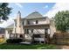 Spacious backyard featuring a deck, fenced yard, and a well-maintained lawn at 4046 Creekview Ridge Dr, Buford, GA 30518