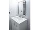 Modern bathroom vanity with white countertop and rectangular framed mirror at 4046 Creekview Ridge Dr, Buford, GA 30518