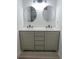 Bathroom featuring double sink vanity with framed mirrors and modern fixtures at 4046 Creekview Ridge Dr, Buford, GA 30518