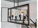 Modern chandelier with geometric design and vintage-style bulbs illuminates the space at 4046 Creekview Ridge Dr, Buford, GA 30518