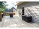 Wooden deck with a black storage box and a view of the neighboring houses at 4046 Creekview Ridge Dr, Buford, GA 30518