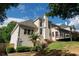 Spacious home featuring multiple windows, an outdoor deck, well-maintained landscaping, and a backyard at 4046 Creekview Ridge Dr, Buford, GA 30518