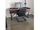 A well-appointed home office with a sleek wooden desk and a stylish leather chair at 4046 Creekview Ridge Dr, Buford, GA 30518