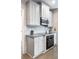 Modern kitchen with stainless steel appliances, granite countertops, and stylish cabinetry at 4046 Creekview Ridge Dr, Buford, GA 30518