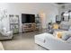 Open-concept living area with hardwood floors, comfortable seating, and modern decor at 4046 Creekview Ridge Dr, Buford, GA 30518