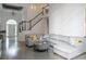 Inviting living room with hardwood floors, stylish furniture, and abundant natural light at 4046 Creekview Ridge Dr, Buford, GA 30518