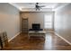 Open living room with hard floors, TV, and natural light from the window at 4046 Creekview Ridge Dr, Buford, GA 30518