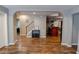Spacious, open-concept living area with hardwood floors and arched doorways to the kitchen and dining room at 4046 Creekview Ridge Dr, Buford, GA 30518