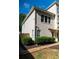 Side view of home featuring well-maintained landscaping and architectural details at 4046 Creekview Ridge Dr, Buford, GA 30518