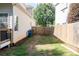 A view of the side yard, featuring a wooden fence and walkway at 4046 Creekview Ridge Dr, Buford, GA 30518