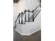 Beautiful staircase with contrasting dark wood and white risers, leading to the upper level at 4046 Creekview Ridge Dr, Buford, GA 30518