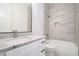 Modern bathroom with marble vanity, sleek fixtures, and shower over tub at 4824 Se Highway 20, Conyers, GA 30013