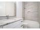 Contemporary bathroom with marble countertops and tiled shower and bath at 4824 Se Highway 20, Conyers, GA 30013