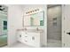 Bathroom featuring double vanity with modern fixtures and a tiled walk-in shower at 4824 Se Highway 20, Conyers, GA 30013