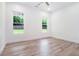 A bright, airy bedroom featuring stylish flooring and two windows offering great views at 4824 Se Highway 20, Conyers, GA 30013