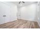 Bedroom featuring modern flooring, ceiling fan, and bright, white walls at 4824 Se Highway 20, Conyers, GA 30013