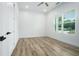 Bedroom with modern flooring, white walls, ceiling fan and bright light from the window at 4824 Se Highway 20, Conyers, GA 30013