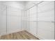 Walk in closet with installed white wire shelving and laminate floors at 4824 Se Highway 20, Conyers, GA 30013