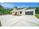 Inviting new construction home boasts a stylish modern farmhouse design and attached two-car garage at 4824 Se Highway 20, Conyers, GA 30013
