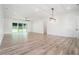 Bright and spacious living area with hardwood floors, recessed lighting, and large sliding glass doors at 4824 Se Highway 20, Conyers, GA 30013
