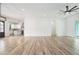 Open-concept living area with hardwood floors, recessed lighting, and a view into the modern kitchen at 4824 Se Highway 20, Conyers, GA 30013