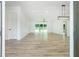 Bright, open-concept living area with hardwood floors, recessed lighting, and a modern ceiling fan at 4824 Se Highway 20, Conyers, GA 30013