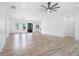Large living room with stylish hardwood floors, modern lighting, and ample space for entertaining at 4824 Se Highway 20, Conyers, GA 30013