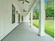 Covered porch features multiple ceiling fans and tall support columns at 4824 Se Highway 20, Conyers, GA 30013