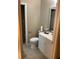 Bathroom with a white vanity, toilet, mirror and vanity with door open to a adjacent room at 5570 Chemin De Vie, Atlanta, GA 30342