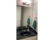 Bathroom with marble countertop, towel rings, and large mirror reflecting a white door at 5570 Chemin De Vie, Atlanta, GA 30342