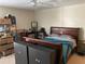 Bedroom with ceiling fan, large bed, and adjacent closet at 5570 Chemin De Vie, Atlanta, GA 30342