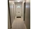 An inviting hallway with tiled floor leading to a white front door at 5570 Chemin De Vie, Atlanta, GA 30342