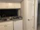 Kitchen featuring a stainless steel sink, dishwasher, and pantry at 5570 Chemin De Vie, Atlanta, GA 30342