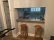 Kitchenette with bar and barstools, countertop and stainless faucet and sink at 5570 Chemin De Vie, Atlanta, GA 30342