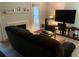 Cozy living room with TV, fireplace, and access to the outdoor patio at 5570 Chemin De Vie, Atlanta, GA 30342