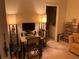 Cozy home office with computer setup, wood desk, ample shelving, and bathroom access at 5570 Chemin De Vie, Atlanta, GA 30342