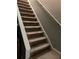Carpeted stairs featuring a sturdy white handrail at 5570 Chemin De Vie, Atlanta, GA 30342