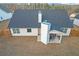 Aerial view of a backyard with a patio, outdoor seating, and a fenced perimeter at 180 Eryn Ter, Covington, GA 30014