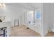 Bright bathroom featuring a soaking tub, dual sinks, and wood look floors at 180 Eryn Ter, Covington, GA 30014
