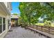 View of the back deck overlooking the green yard and lush landscaping at 230 Channings Lake Dr, Lawrenceville, GA 30043