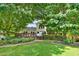 Mature backyard with mature trees, a deck and beautiful landscaping at 230 Channings Lake Dr, Lawrenceville, GA 30043