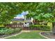 Charming backyard with a deck, lush greenery, and a well-maintained lawn at 230 Channings Lake Dr, Lawrenceville, GA 30043