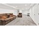Spacious carpeted basement featuring a sitting area and desk at 230 Channings Lake Dr, Lawrenceville, GA 30043